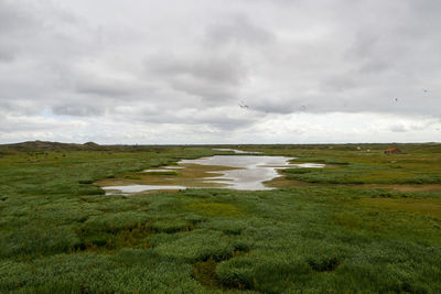 Scenic view of land against sky
