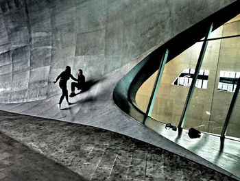 Men walking on road in city