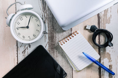 High angle view of clock on table