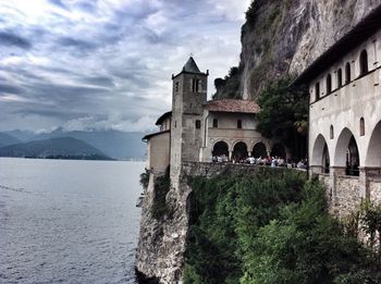 Castle by mountain against sky