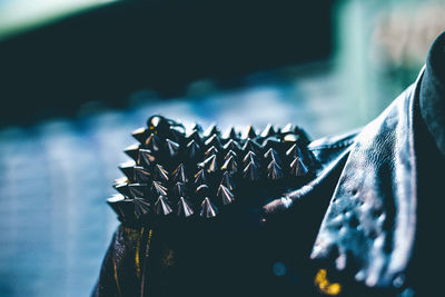 Close-up of spiked metal on leather jacket