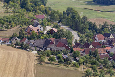 High angle view of houses and trees in village