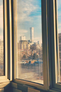 Cityscape seen through glass window