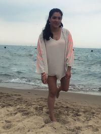 Woman standing on beach