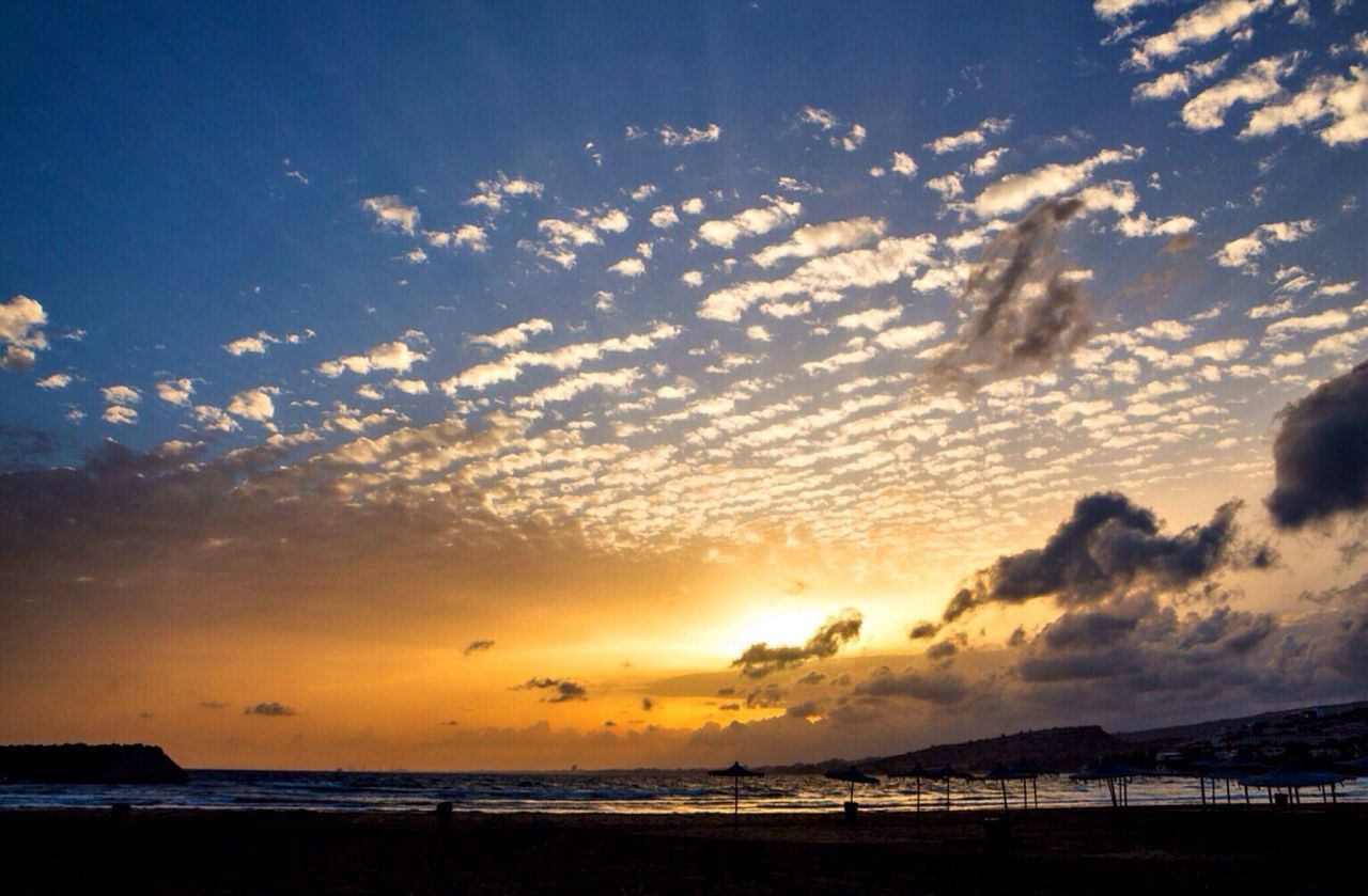 sea, sunset, horizon over water, water, scenics, sky, beauty in nature, tranquil scene, beach, tranquility, orange color, idyllic, cloud - sky, silhouette, nature, shore, cloud, sun, dramatic sky, outdoors