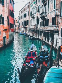 Boats moored in canal