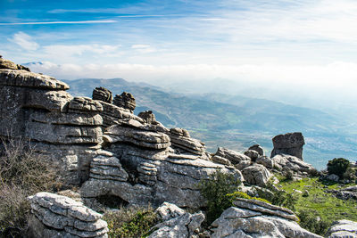 Panoramic view of rocks and mountains against sky