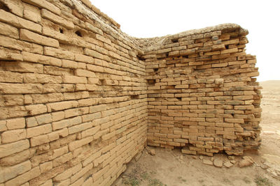 Low angle view of stone wall