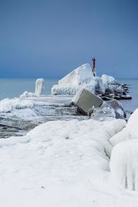 Built structure in snow against sky