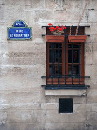 Low angle view of sign on wall