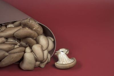 High angle view of cupcakes on table against red background