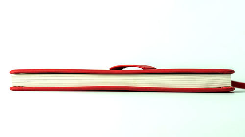 High angle view of books against white background