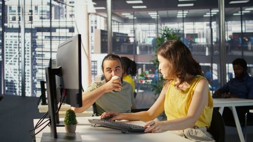 Young woman using mobile phone in cafe