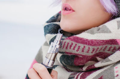 Close-up of young woman holding hands