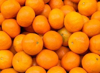 Full frame shot of oranges at market stall