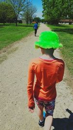 Rear view of woman with multi colored umbrella