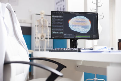 Midsection of scientist working in laboratory