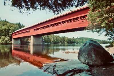 Bridge over lake against sky