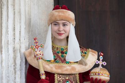 Smiling teenage girl wearing traditional clothes