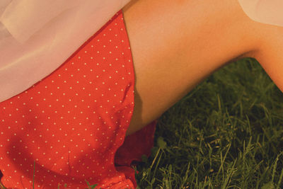 Low section of woman relaxing on land