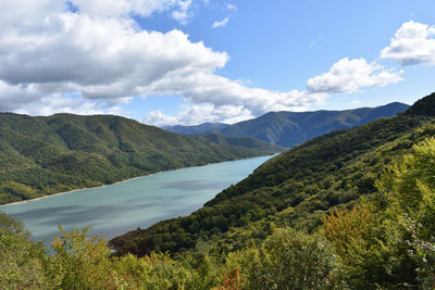 Scenic view of landscape and mountains against sky