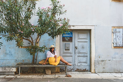 Man sitting outside building