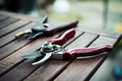 Close-up of pruning shears on table