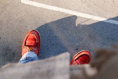 Low section of person on road