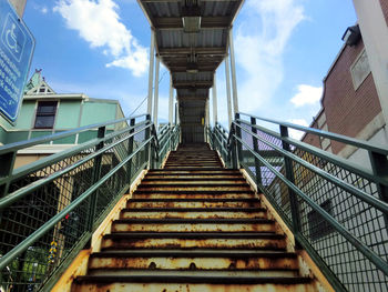 Low angle view of stairs against sky