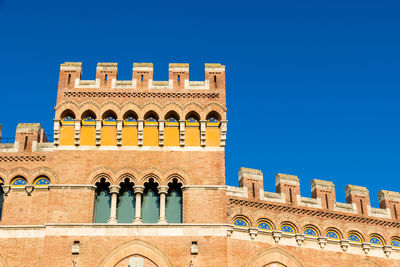 Low angle view of building against blue sky