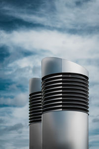 Low angle view of smoke stack against sky