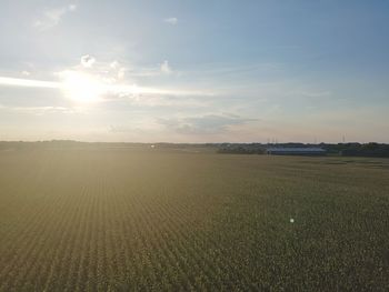 Scenic view of field against sky during sunset