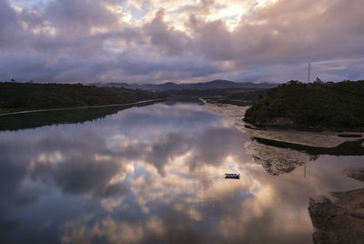 High angle view of reflection in sea against sky