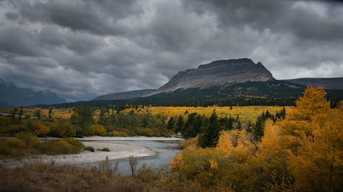 Scenic view of lake and mountains against sky