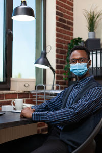 Man sitting in office during pandemic