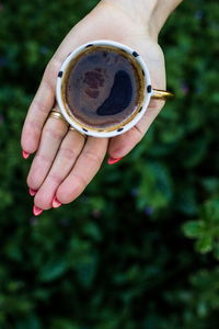 Midsection of woman holding drink