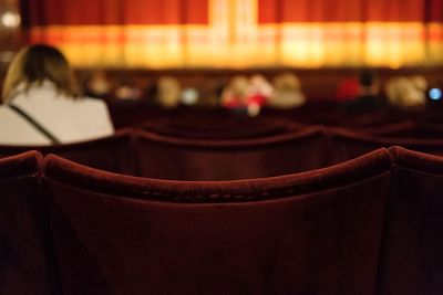 Close-up of person on seat in stage