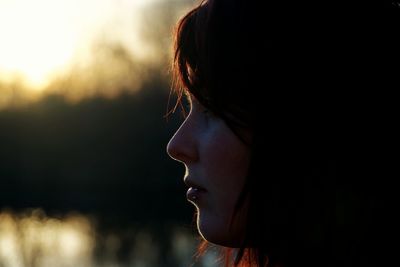 Close-up of young woman looking away