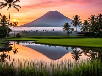 Scenic view of lake against sky during sunset