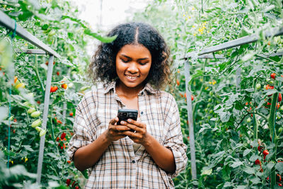 Young woman using mobile phone