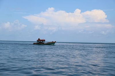 Boat in sea against sky