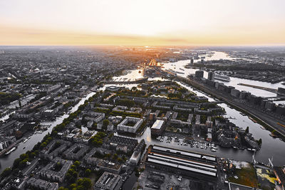 High angle view of city against sky during sunset