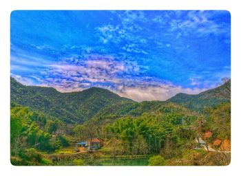 Scenic view of landscape against blue sky