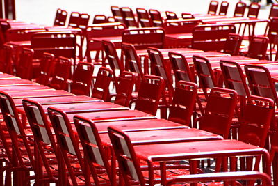 Close-up of empty chairs and tables