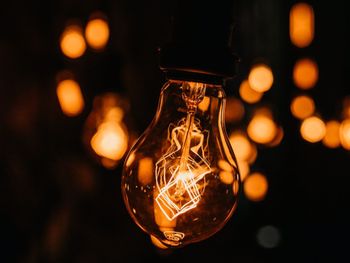 Close-up of illuminated light bulb