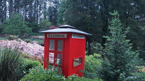 Red information sign in forest