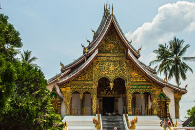 Low angle view of temple and building against sky