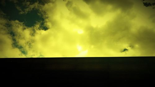 Low angle view of cloudy sky at sunset