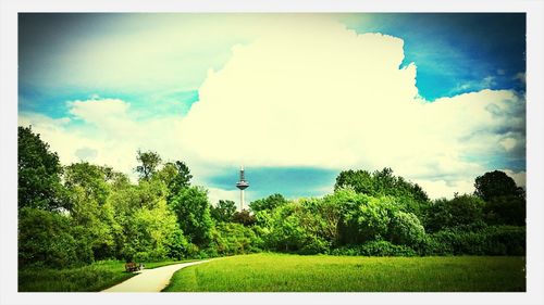 Scenic view of landscape against cloudy sky