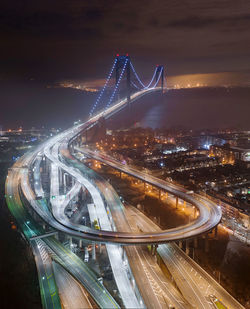 High angle view of light trails on highway at night